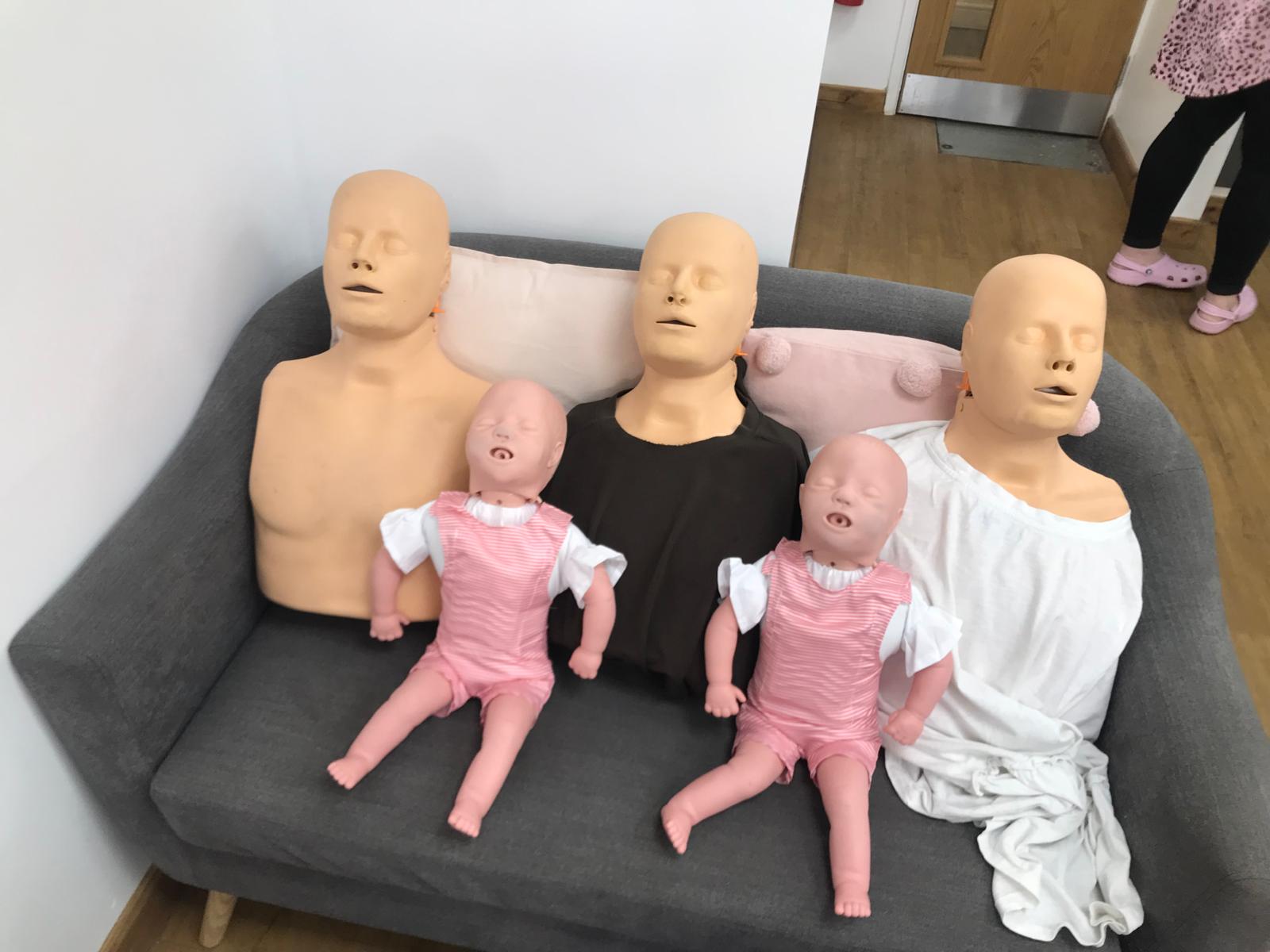 Practical first aid training equipment prepared in a classroom